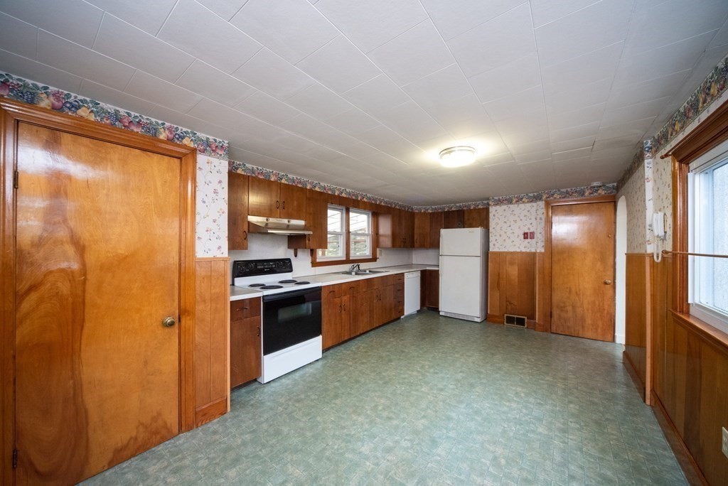 263 State Road Templeton, MA 01436 - Photo 3 of 31 a large kitchen with a stove a refrigerator and a sink