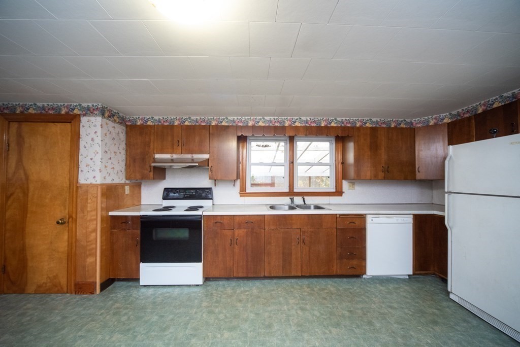 263 State Road Templeton, MA 01436 - Photo 5 of 31 a kitchen with stainless steel appliances kitchen island granite countertop a refrigerator and a stove top oven