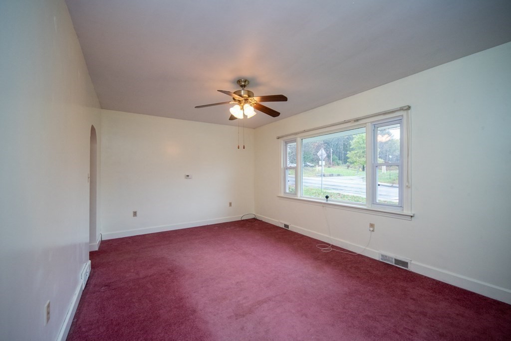 263 State Road Templeton, MA 01436 - Photo 8 of 31 an empty room with chandelier fan and windows