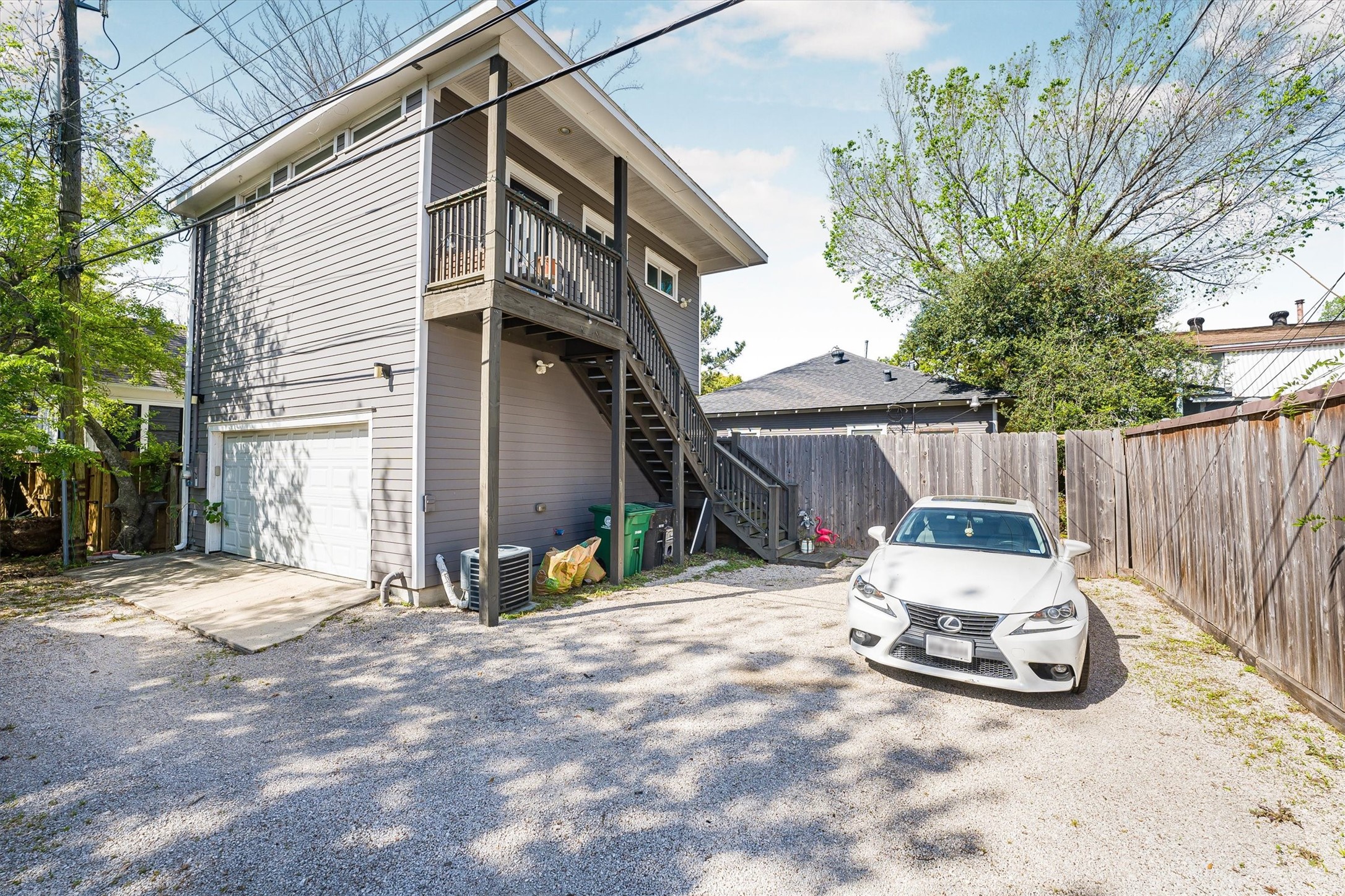 210 Tabor Street Houston, TX 77009 - Photo 3 of 18 Access to the apartment is through the alleyway: which keeps the backyard private for the homeowner/main house tenant.