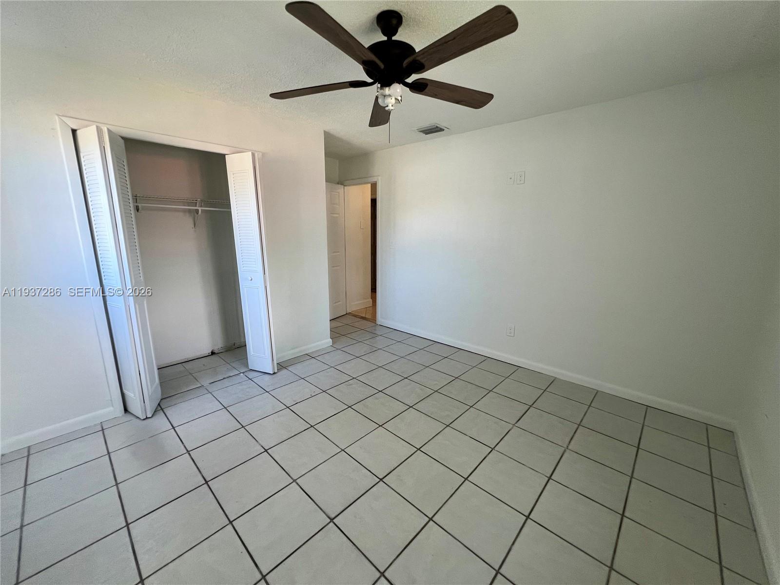11950 Southwest 199th Street, Unit 1 Miami, FL 33177 - Photo 15 of 30 a view of an empty room
