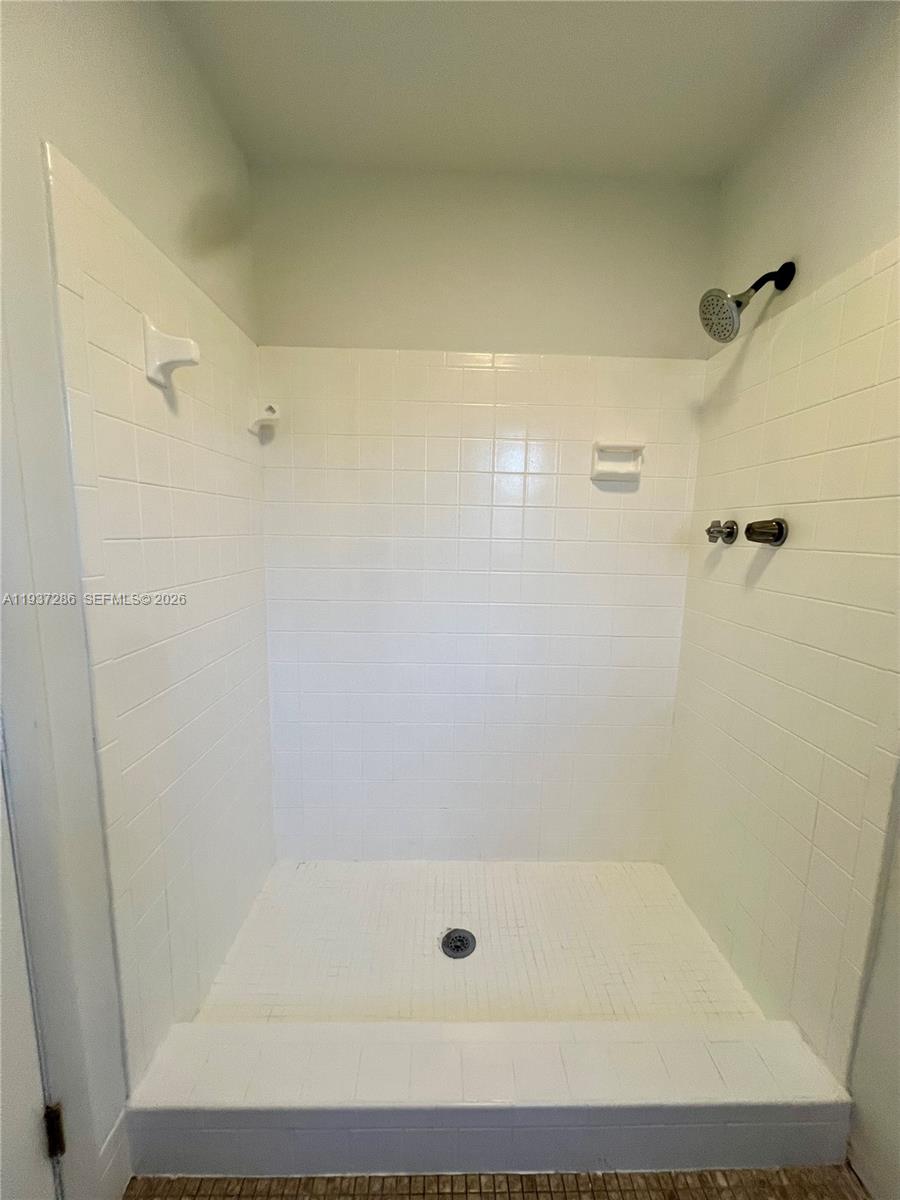 11950 Southwest 199th Street, Unit 1 Miami, FL 33177 - Photo 22 of 30 a bathroom with a shower