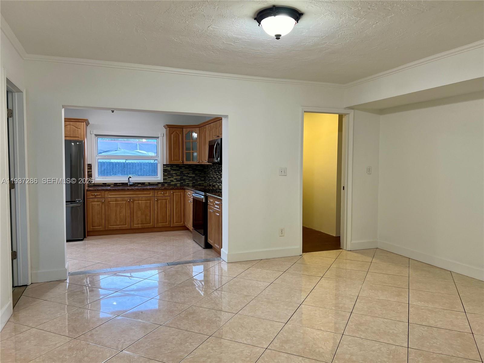 11950 Southwest 199th Street, Unit 1 Miami, FL 33177 - Photo 23 of 30 a view of a kitchen with a sink and cabinets