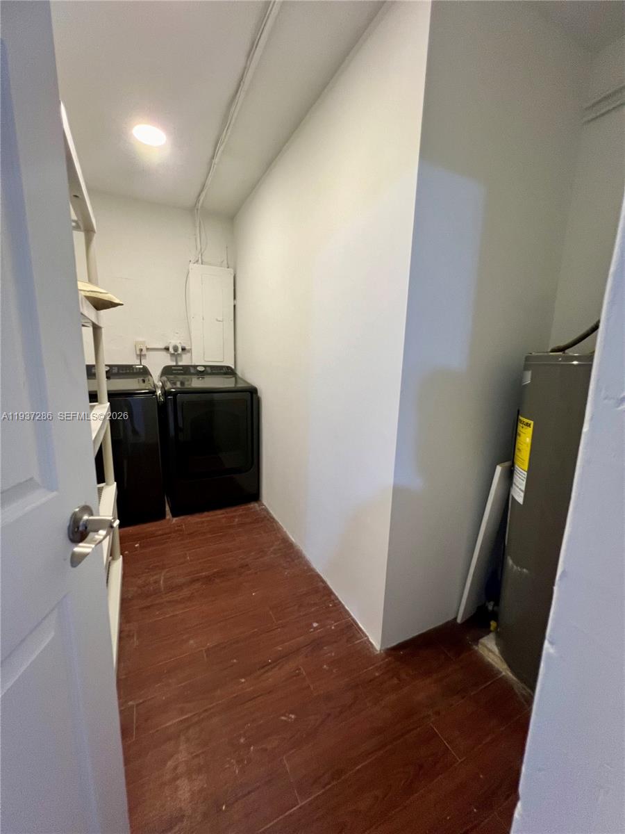 11950 Southwest 199th Street, Unit 1 Miami, FL 33177 - Photo 27 of 30 a view of storage and utility room with wooden floor