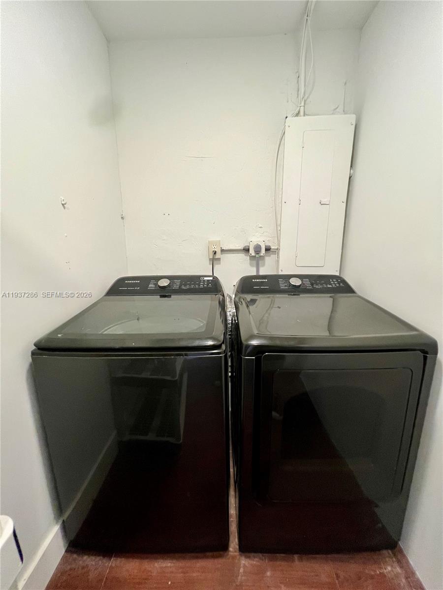 11950 Southwest 199th Street, Unit 1 Miami, FL 33177 - Photo 28 of 30 a utility room with washer and dryer