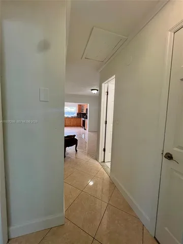 a view of a hallway with seating area