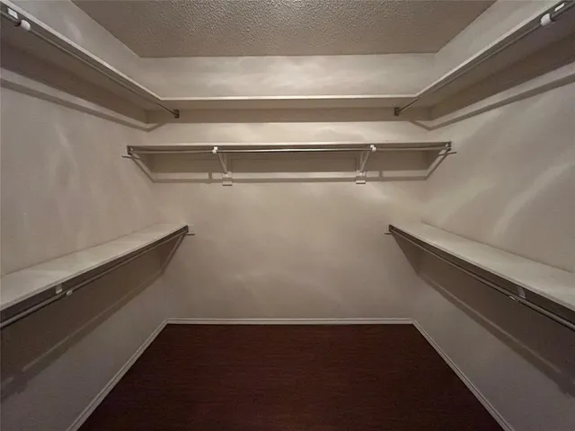 a view of storage and utility room with racks on the wall