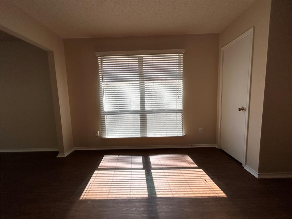 7917 Rattlers Court Arlington, TX 76002 - Photo 6 of 21 a view of an empty room with a window