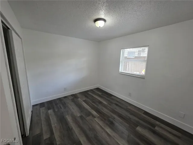 an empty room with a bench