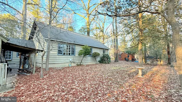 a wooden bench sitting in front of a building