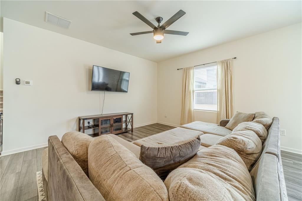 222 Knightsbridge Lane Winder, GA 30680 - Photo 13 of 39 a bedroom with a bed and a flat screen tv