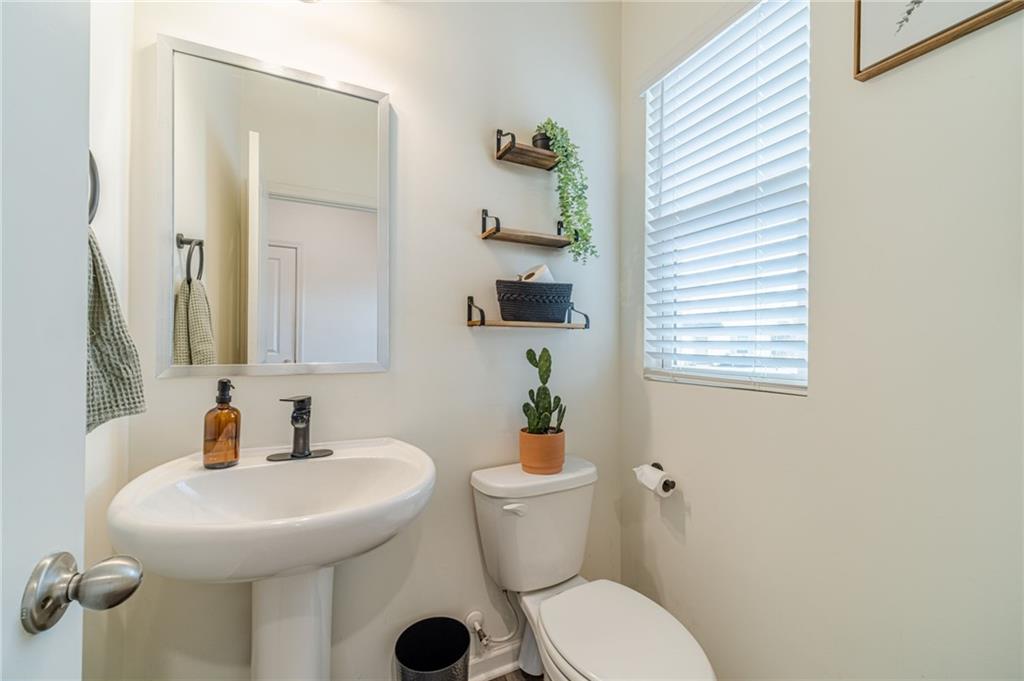 222 Knightsbridge Lane Winder, GA 30680 - Photo 15 of 39 a bathroom with a sink toilet and a mirror