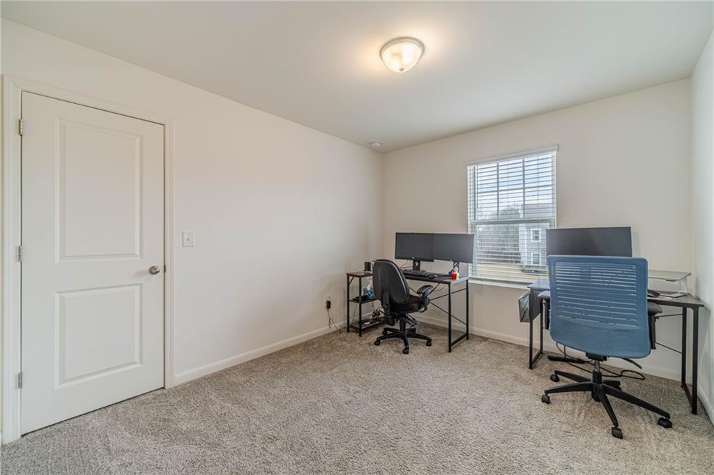 222 Knightsbridge Lane Winder, GA 30680 - Photo 17 of 39 a view of a workspace with furniture and a window
