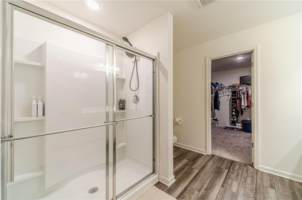 222 Knightsbridge Lane Winder, GA 30680 - Photo 22 of 39 a bathroom with a glass shower door