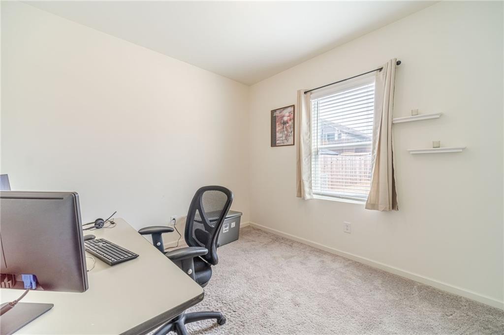 222 Knightsbridge Lane Winder, GA 30680 - Photo 27 of 39 a view of a room that has a bed and a table in it