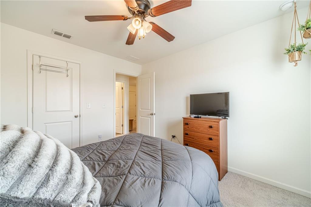 222 Knightsbridge Lane Winder, GA 30680 - Photo 28 of 39 a bedroom with a bed and a flat screen tv