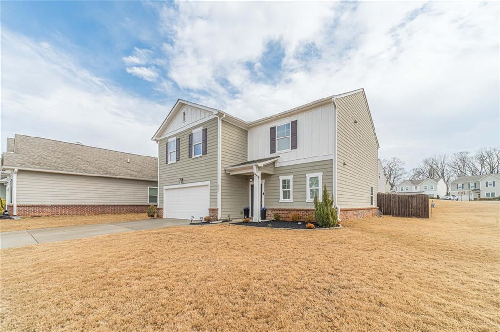 222 Knightsbridge Lane Winder, GA 30680 - Photo 3 of 39 a front view of a house with a yard