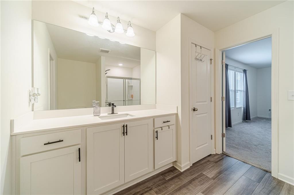 222 Knightsbridge Lane Winder, GA 30680 - Photo 32 of 39 a spacious bathroom with a double vanity sink mirror and shower