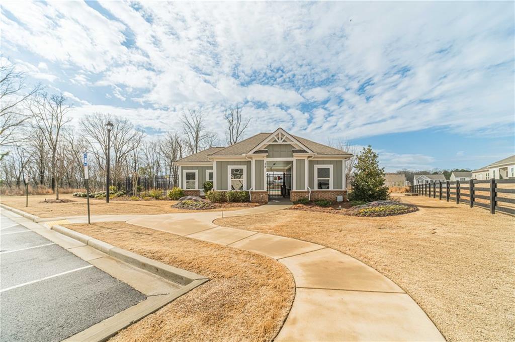 222 Knightsbridge Lane Winder, GA 30680 - Photo 38 of 39 a front view of a house with a yard and garage