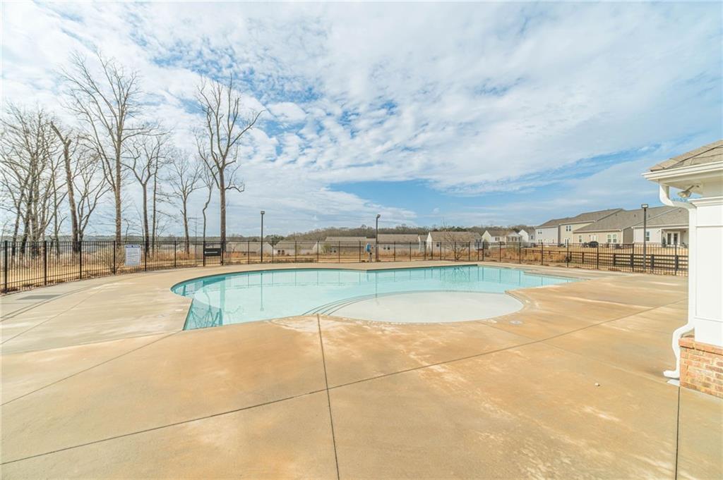 222 Knightsbridge Lane Winder, GA 30680 - Photo 39 of 39 a view of swimming pool with outdoor seating and in the background