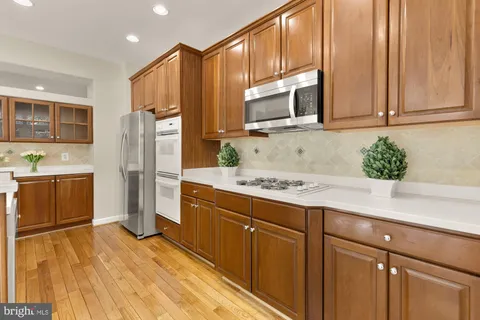 a kitchen with a sink and large window