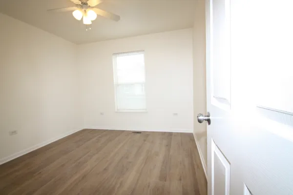 a view of a room with a dishwasher and a window