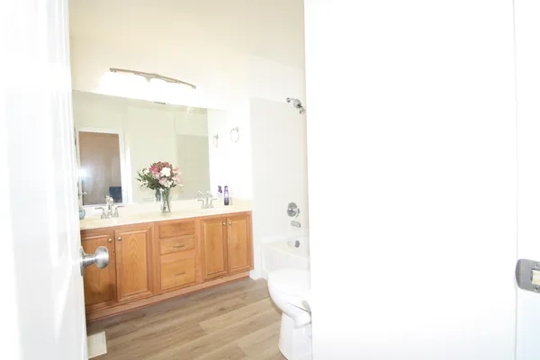 a large bathroom with a sink and a mirror