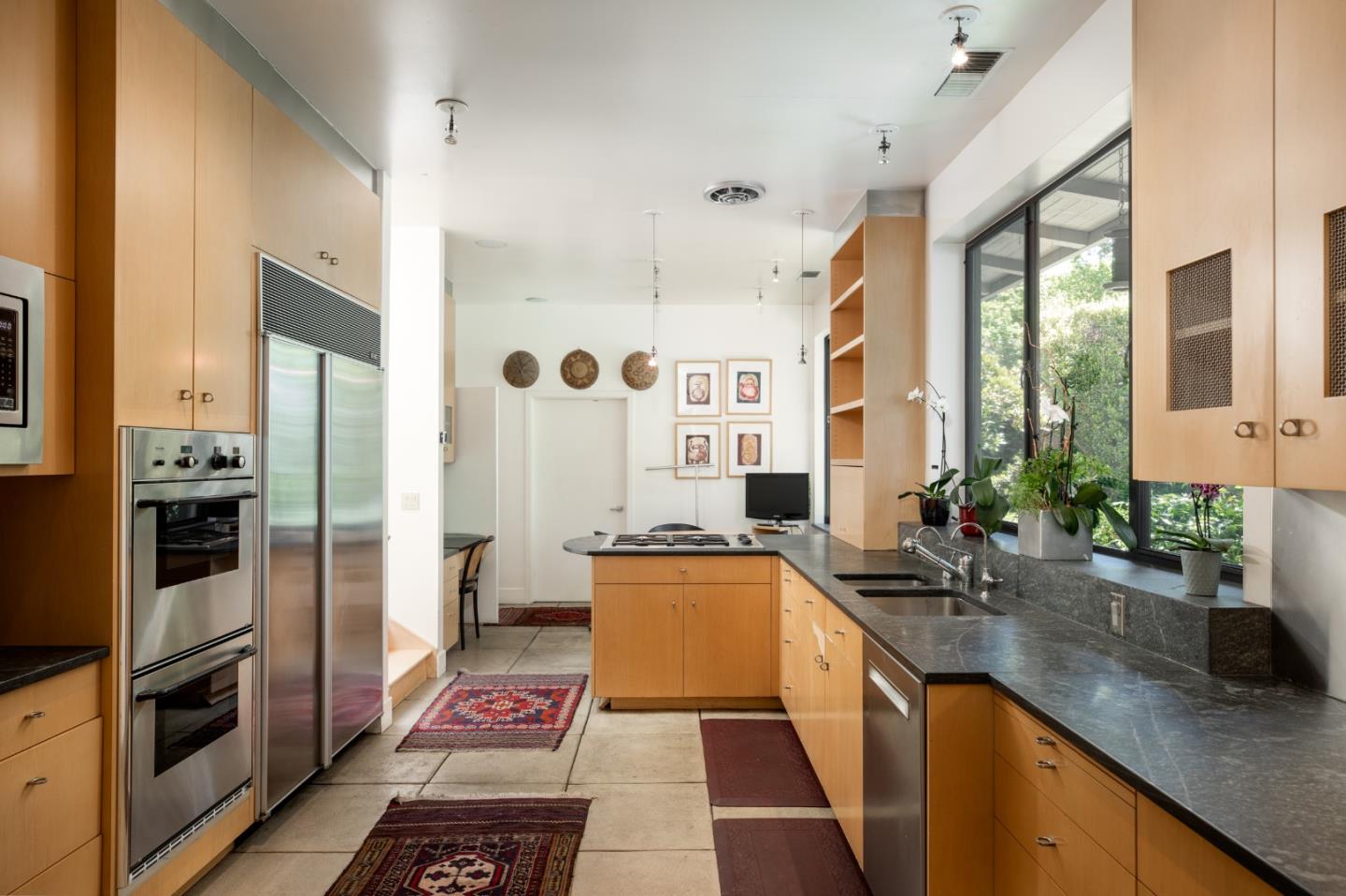 140 Degas Road Portola Valley, CA 94028 - Photo 12 of 31 a kitchen with stainless steel appliances a sink stove and refrigerator