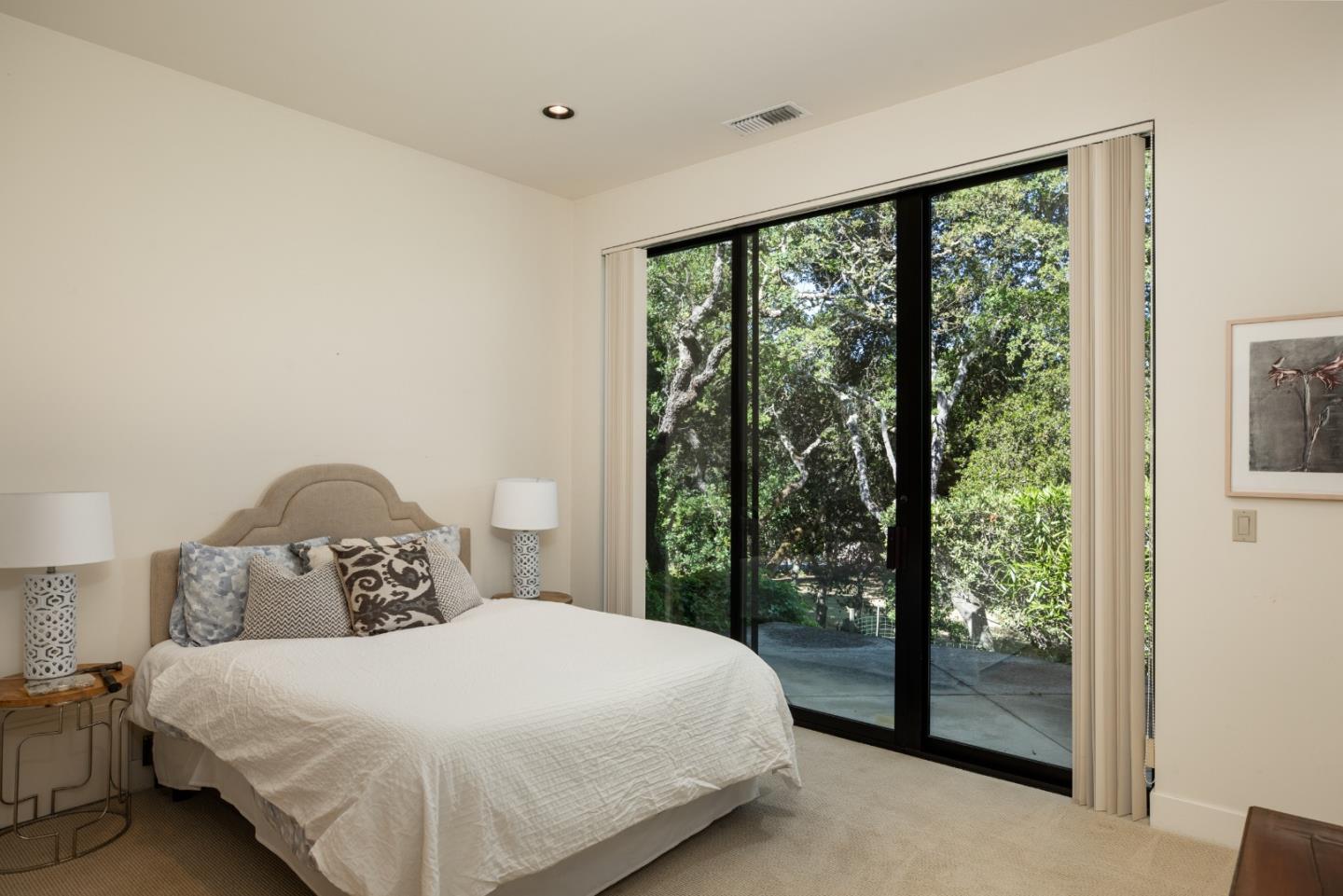 140 Degas Road Portola Valley, CA 94028 - Photo 13 of 31 a bedroom with a large bed and a large window