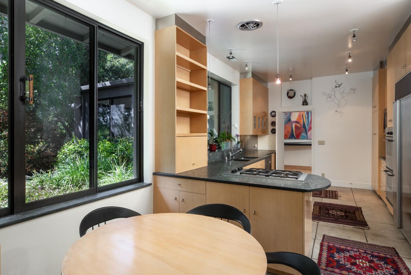140 Degas Road Portola Valley, CA 94028 - Photo 16 of 31 a bedroom with a bed and large windows