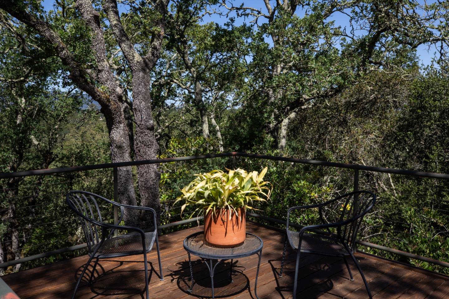 140 Degas Road Portola Valley, CA 94028 - Photo 26 of 31 a backyard of a house with table and chairs
