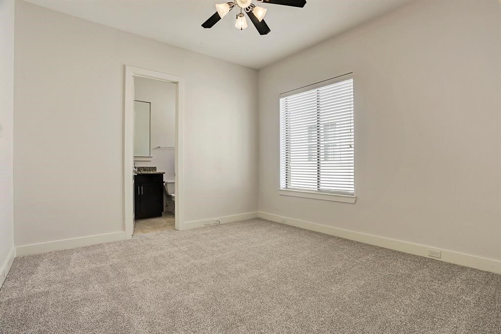 1203 Detering Street Houston, TX 77007 - Photo 13 of 15 an empty room with chandelier fan and windows