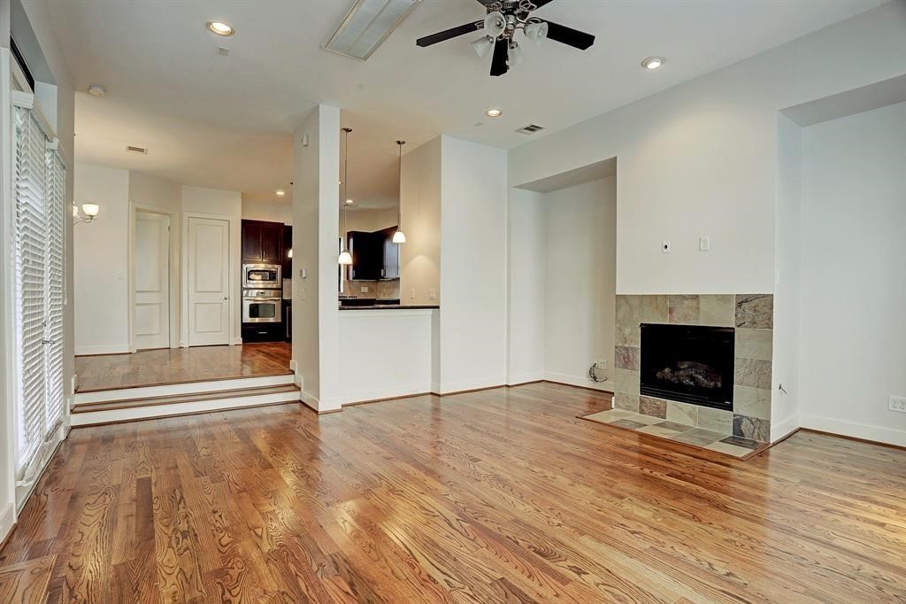 1203 Detering Street Houston, TX 77007 - Photo 2 of 14 Step down from kitchen/dining to living room.