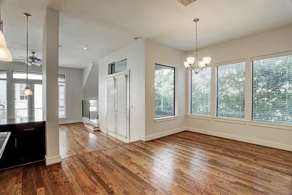 1203 Detering Street Houston, TX 77007 - Photo 5 of 15 a view of empty room with wooden floor and fan