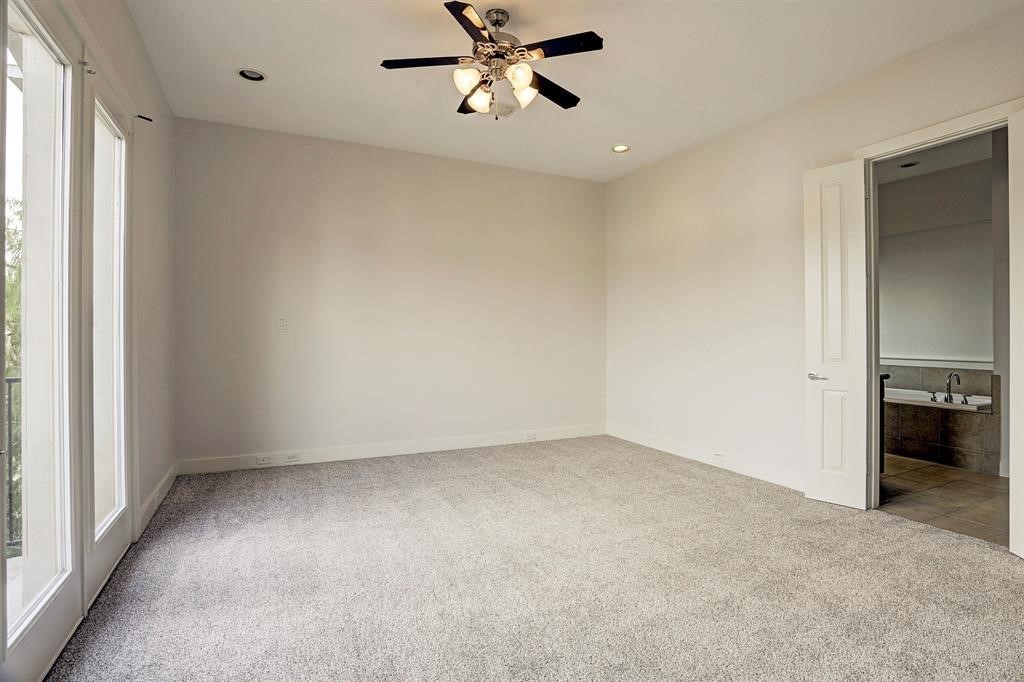 1203 Detering Street Houston, TX 77007 - Photo 8 of 15 an empty room with closet and a ceiling fan