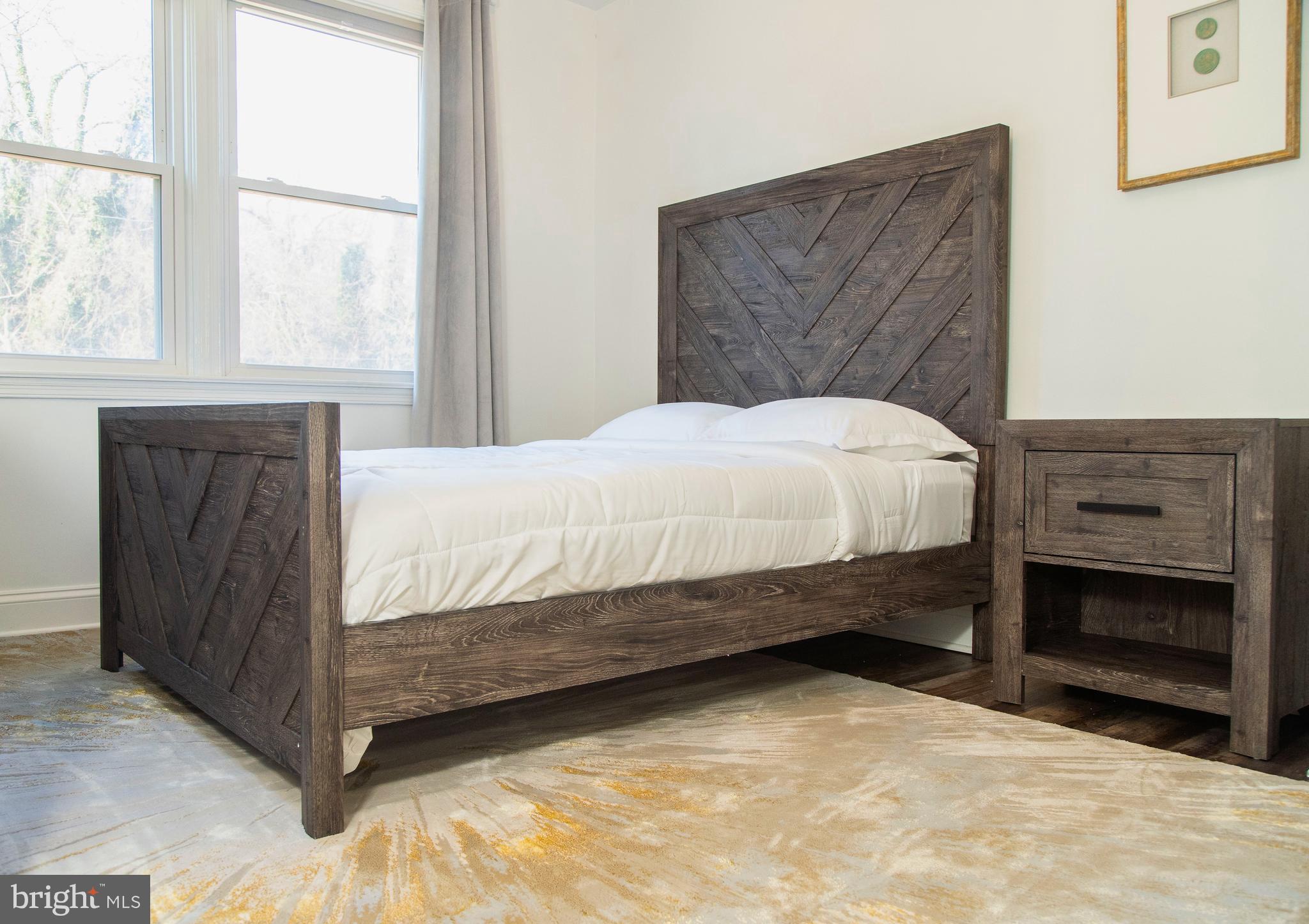 518 Random Road Baltimore, MD 21229 - Photo 15 of 29 a bedroom with a bed and a window