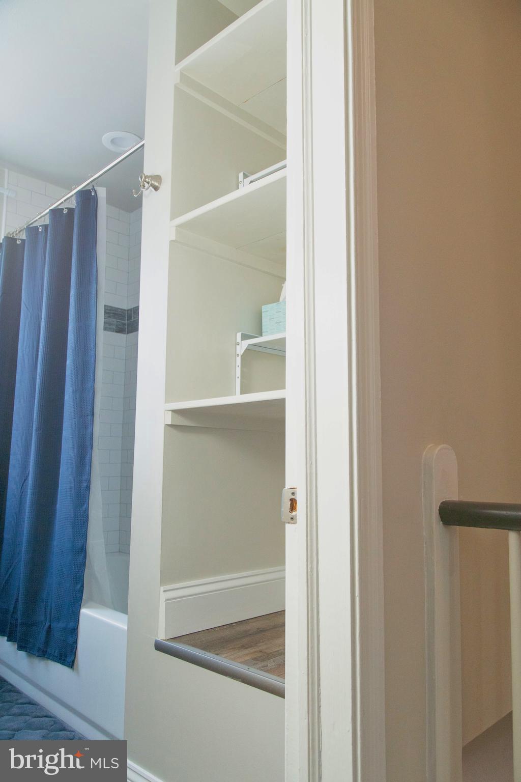 518 Random Road Baltimore, MD 21229 - Photo 18 of 29 a bathroom with a glass shower door and a sink