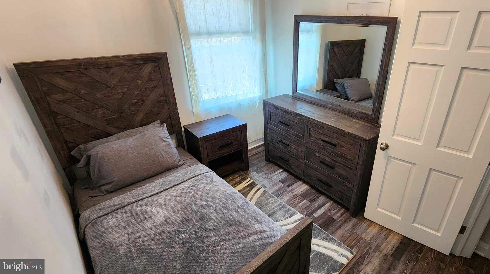 518 Random Road Baltimore, MD 21229 - Photo 20 of 29 a living room with furniture and a dresser