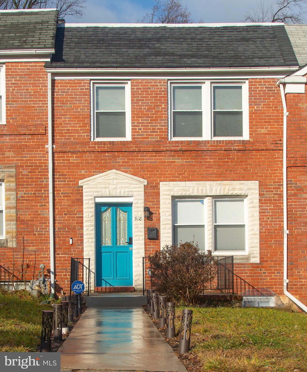 518 Random Road Baltimore, MD 21229 - Photo 27 of 29 a front view of a house having yard