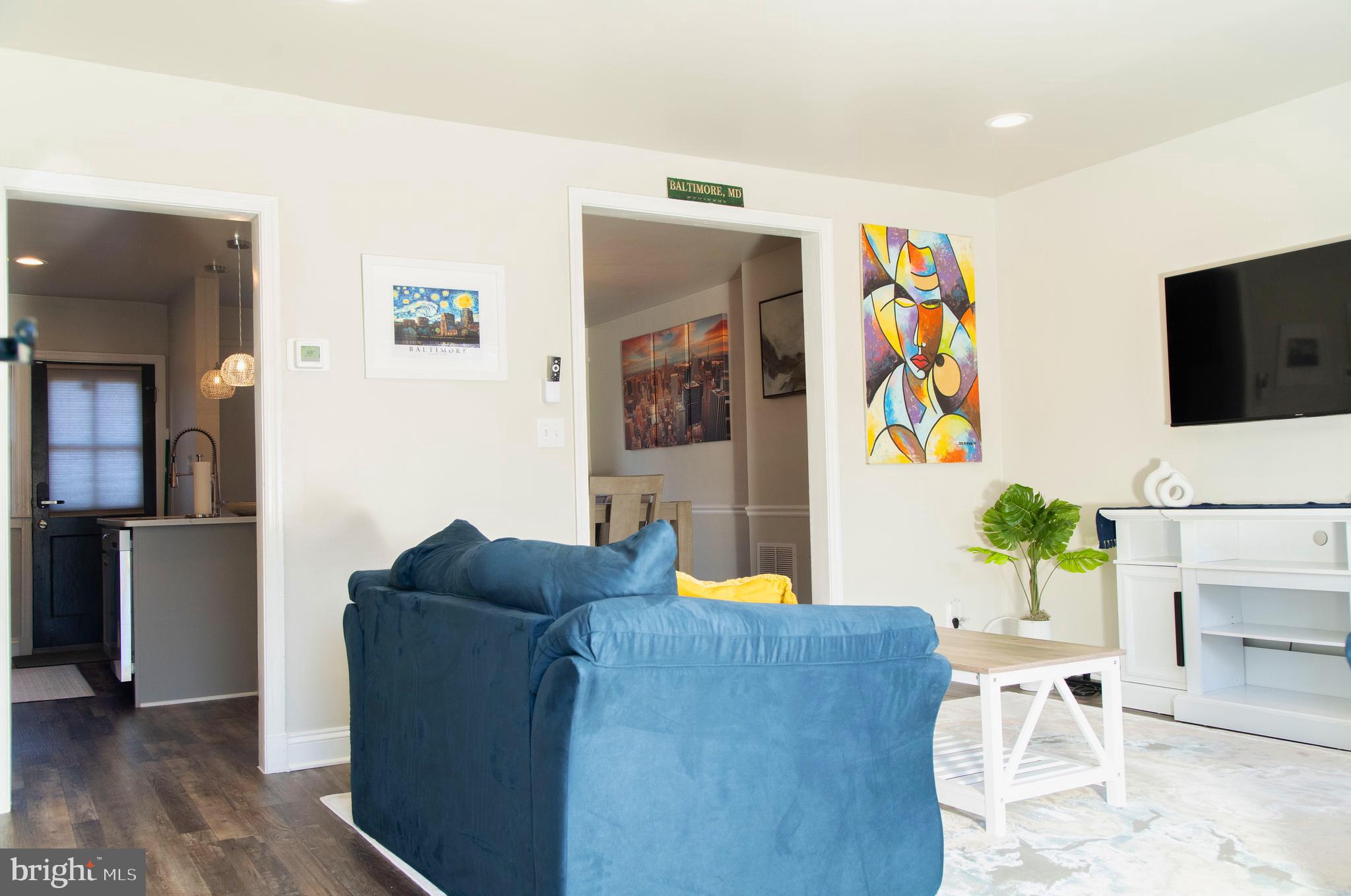 518 Random Road Baltimore, MD 21229 - Photo 3 of 29 a living room with furniture and a flat screen tv