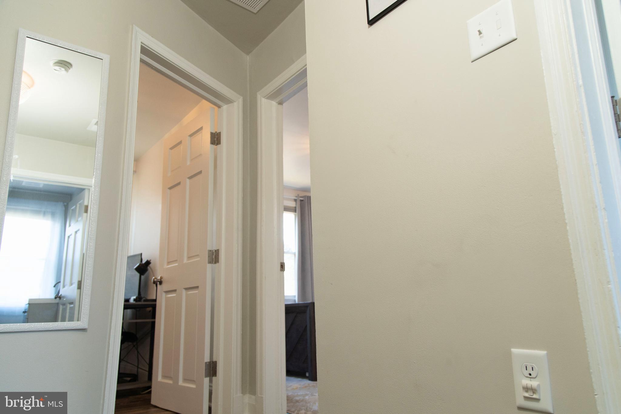 518 Random Road Baltimore, MD 21229 - Photo 10 of 29 a view of a bathroom from a hallway