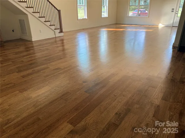 a view of stairs and wooden floor