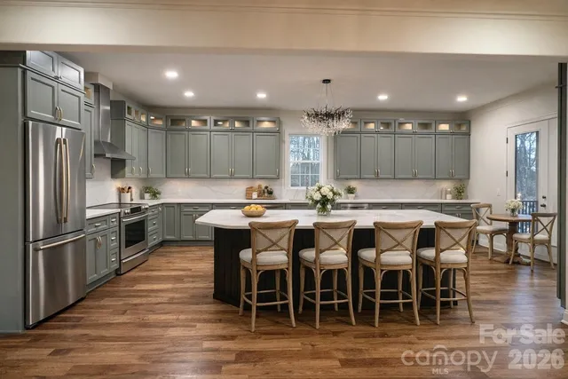 a spacious bedroom with a bed and a window