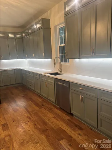 a view of a room with wooden floor