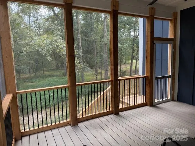 a view of balcony with wooden floor