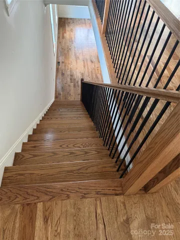 a view of a livingroom with a ceiling fan and window