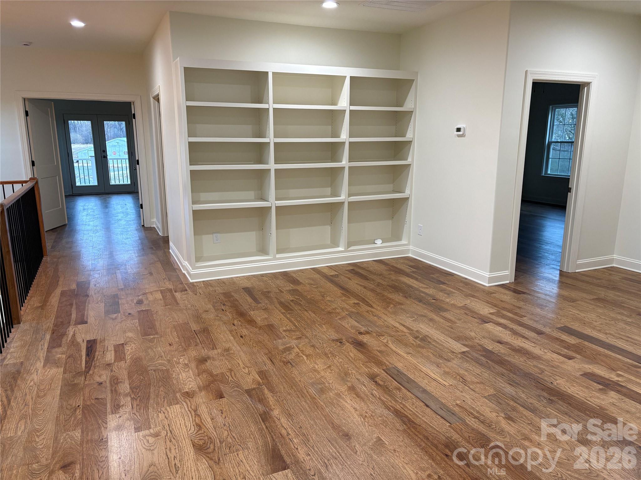 7217 Tesh Road, Unit 5 Monroe, NC 28110 - Photo 26 of 48 a view of an empty room with wooden floor and a window