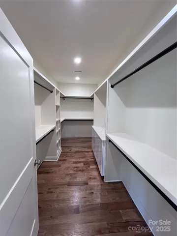 a bathroom with a sink vanity and a mirror