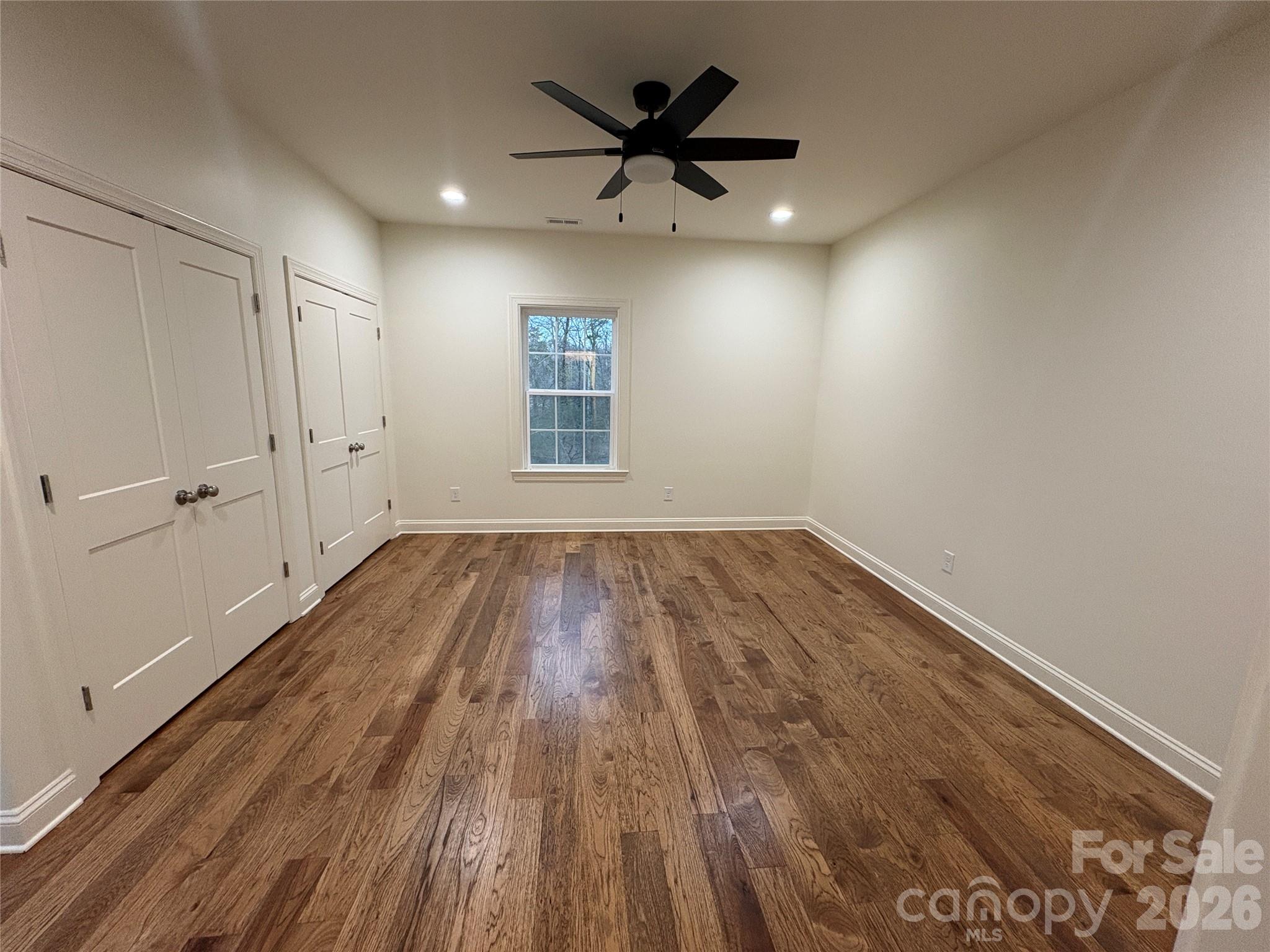 7217 Tesh Road, Unit 5 Monroe, NC 28110 - Photo 28 of 48 wooden floor in an empty room with a window