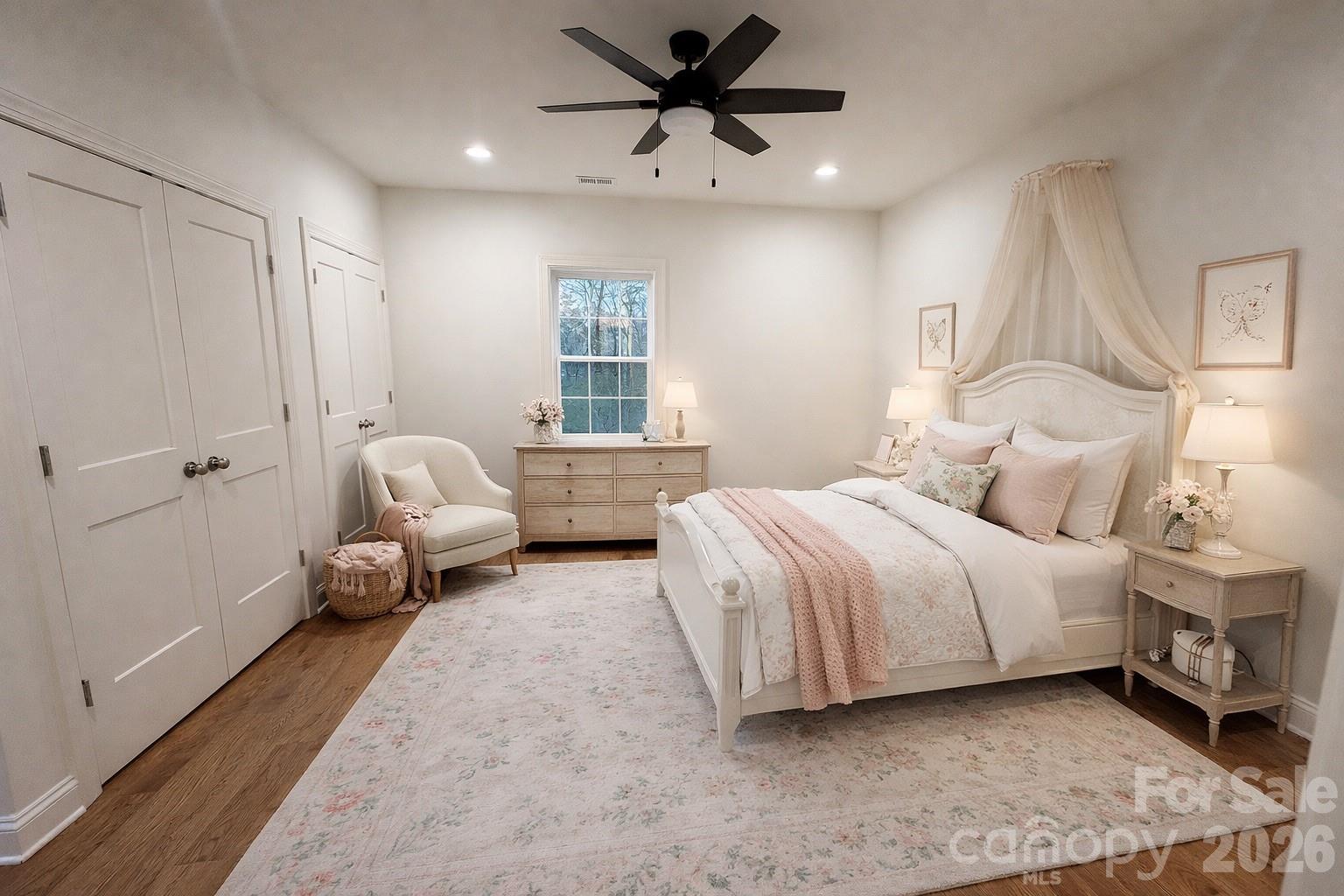 7217 Tesh Road, Unit 5 Monroe, NC 28110 - Photo 29 of 48 a spacious bedroom with a bed couch and a window